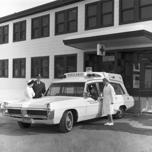 Firefighters / Ambulance Attendants showing off their new unit.  Picture taken March 67.