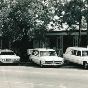 My Funeral Home in about 1969. 196? Ford Econoline, 1969 Mercury Station Wagon, 1967 Pontiac Superior Combination, 1966 Cad M&M combination.  Alma, Ga