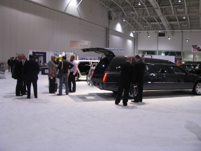 Everyone checking out the Hatchback Hearse operated by a remote.