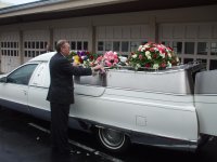 Brady Smith placing flowers on coach..jpg