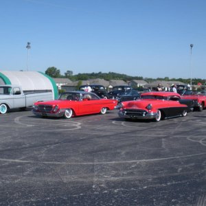 405 picture of my chopped top 1955 olds, and chrysler300 and some of the club cars going to a local show