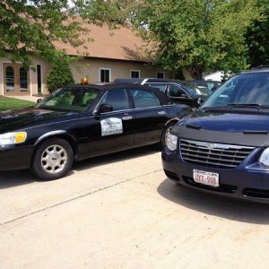 2001 Lincoln Town Car and 2005 Chrysler Town & Country Van