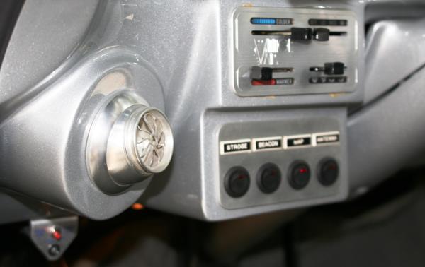 Control detail - hand formed metalwork on dash - Vintage Air controls, accessory controls, and AC port.