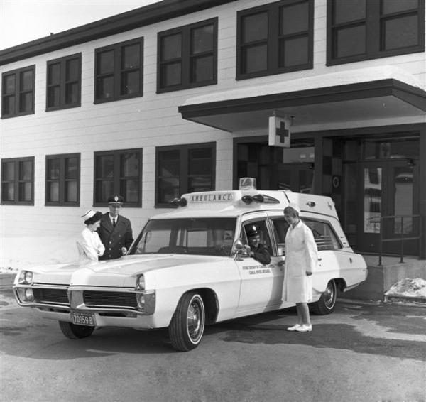 Firefighters / Ambulance Attendants showing off their new unit.  Picture taken March 67.