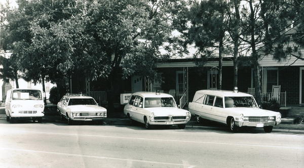 My Funeral Home in about 1969. 196? Ford Econoline, 1969 Mercury Station Wagon, 1967 Pontiac Superior Combination, 1966 Cad M&M combination.  Alma, Ga