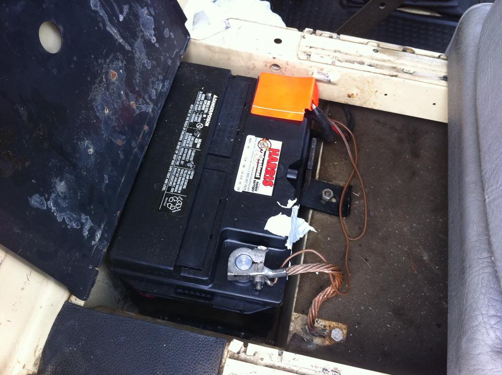 New battery located beneath front right passenger's seat.
