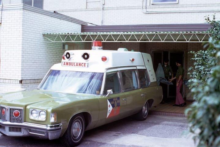 Pontiac Superior Ambulance at an area hospital.  Early uniforms were simply kelly green shirts and bell bottoms...
Notice that this unit had only one 