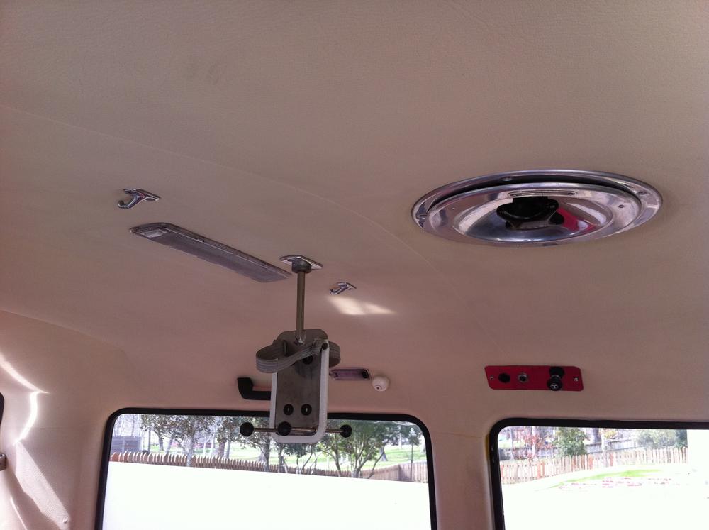 Removable IV pole, operational vent fan, fluorescent light, driver buzzer, power socket, and light control.